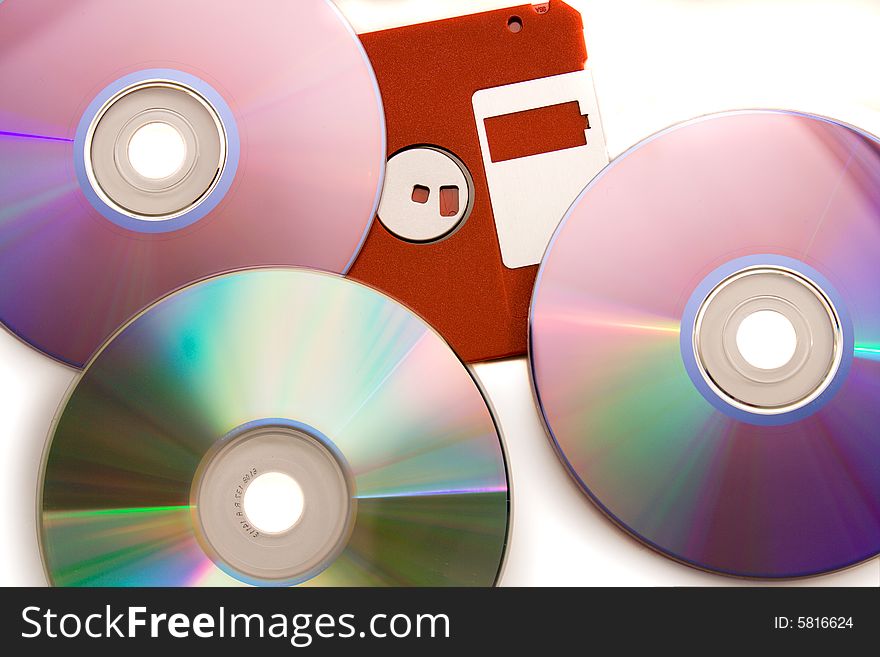 Old diskette under CD - DVD disks. Old diskette under CD - DVD disks