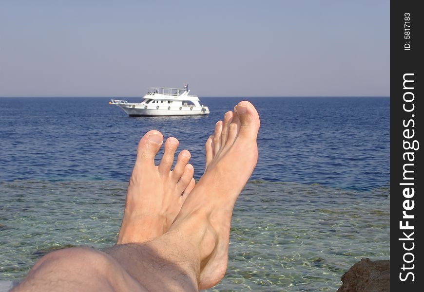 Relaxing view of boat after feet from coral shore. Relaxing view of boat after feet from coral shore