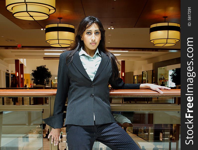 Young attractive businesswoman in a modern shopping mall. Young attractive businesswoman in a modern shopping mall.