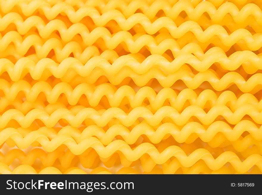 Spaghetti in the form of spirals as a background. Spaghetti in the form of spirals as a background