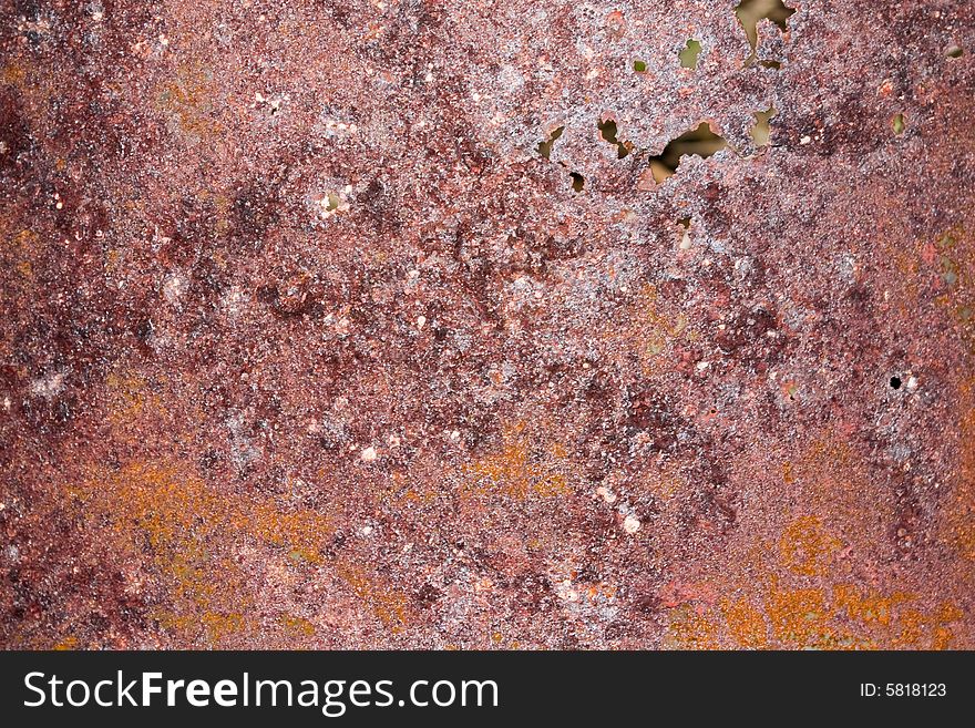 Rusty metal background with some holes