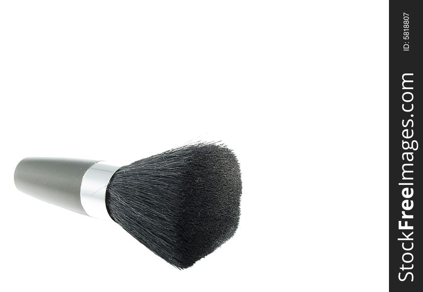 Cosmetic brush in isolated white background.