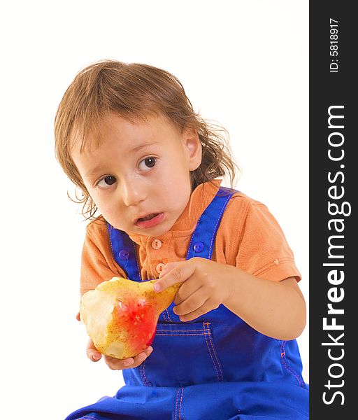 Little boy is eating pear on white background. Little boy is eating pear on white background