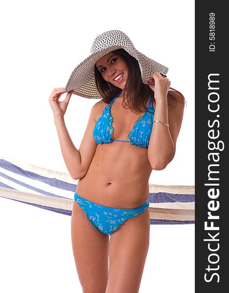 woman wearing bikini with summer hat and hammock on the background. woman wearing bikini with summer hat and hammock on the background