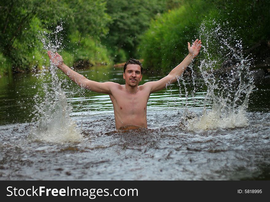 Young man divorces hands in hand and jumps from the wate. Young man divorces hands in hand and jumps from the wate