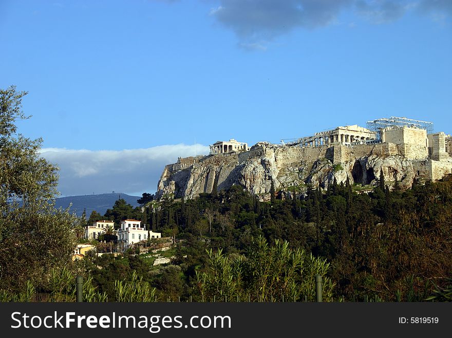 The Acropolis in Athens, Greece sitting on top of a hill. The Acropolis in Athens, Greece sitting on top of a hill.