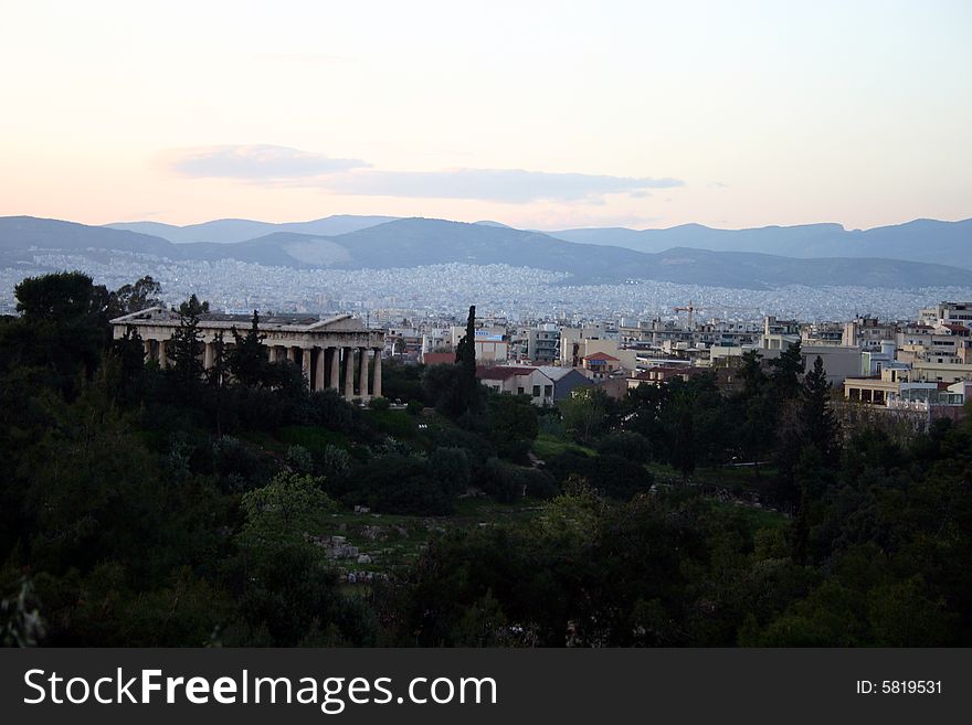 A city view of Athens,Greece with trees in the foreground. A city view of Athens,Greece with trees in the foreground.