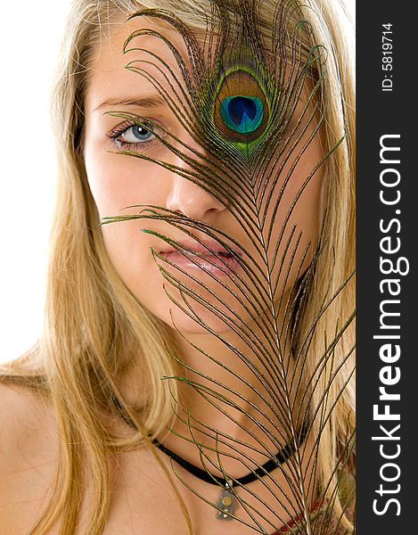 Portrait of beautiful girl with peacock a feather. Isolated over white background