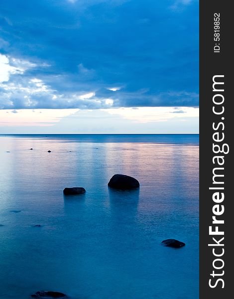 Stones in the sea at night.