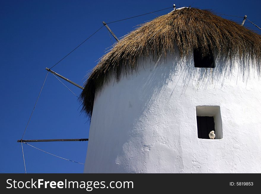 The famous white Windmills on Mykonos, a Greek island. The famous white Windmills on Mykonos, a Greek island.