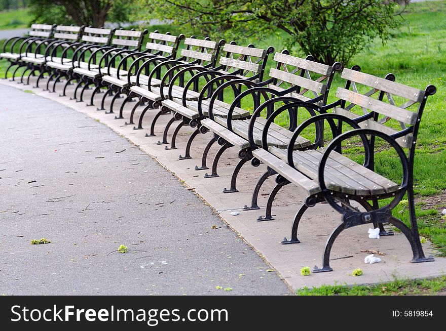 Benches by a half-round in park. Nobody is present. Benches by a half-round in park. Nobody is present