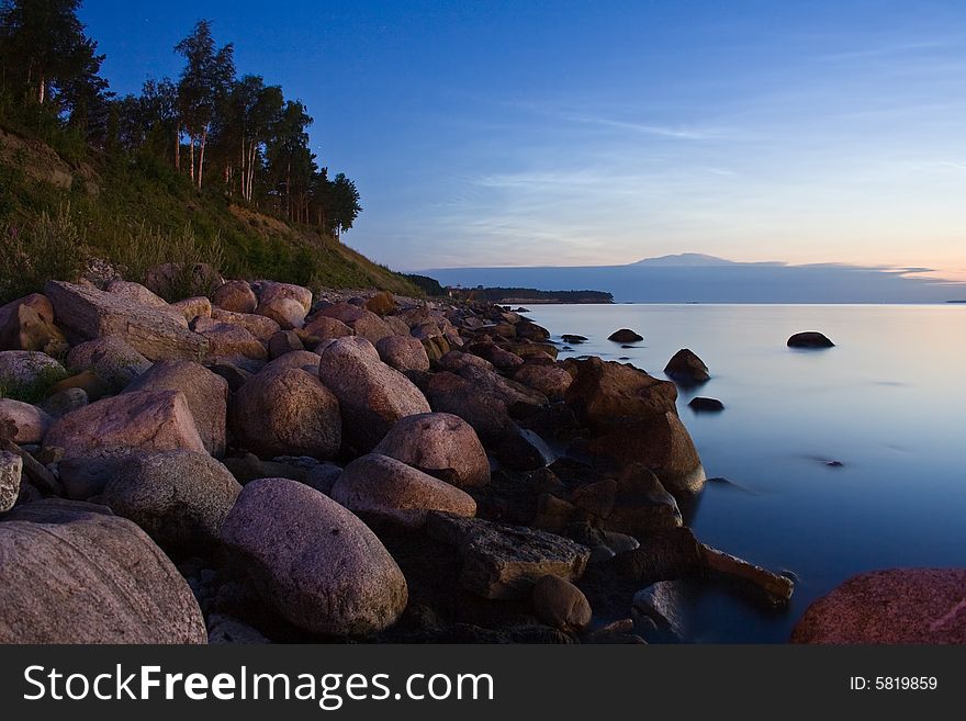 Seashore with stones at night. Seashore with stones at night