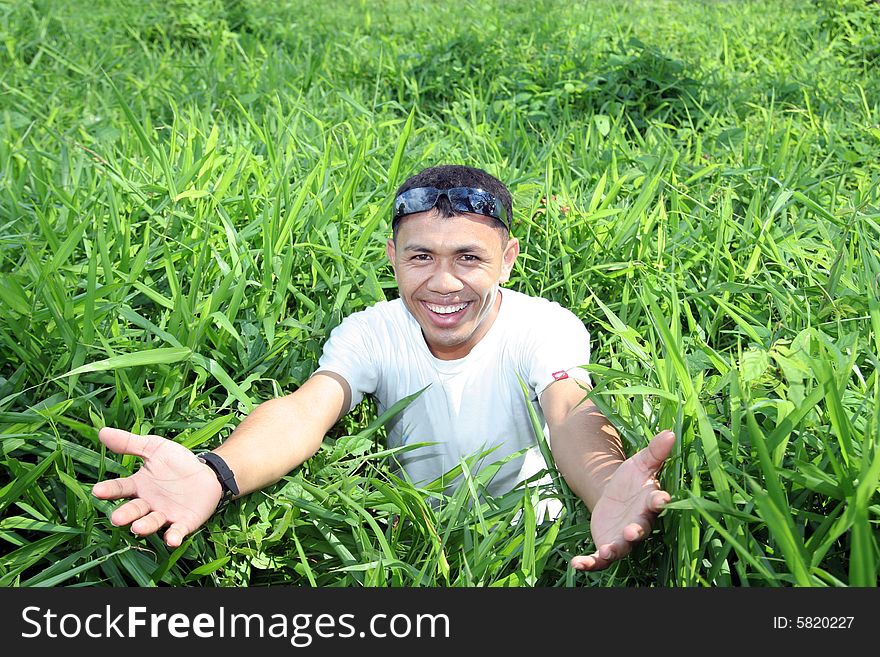 Man in green field