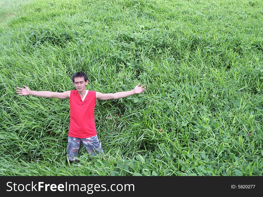 Man in the green field, copy space