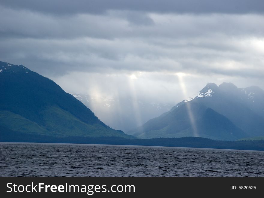 Alaska sun rays from the waters near Tenakee Springs, Alaska  . Alaska sun rays from the waters near Tenakee Springs, Alaska