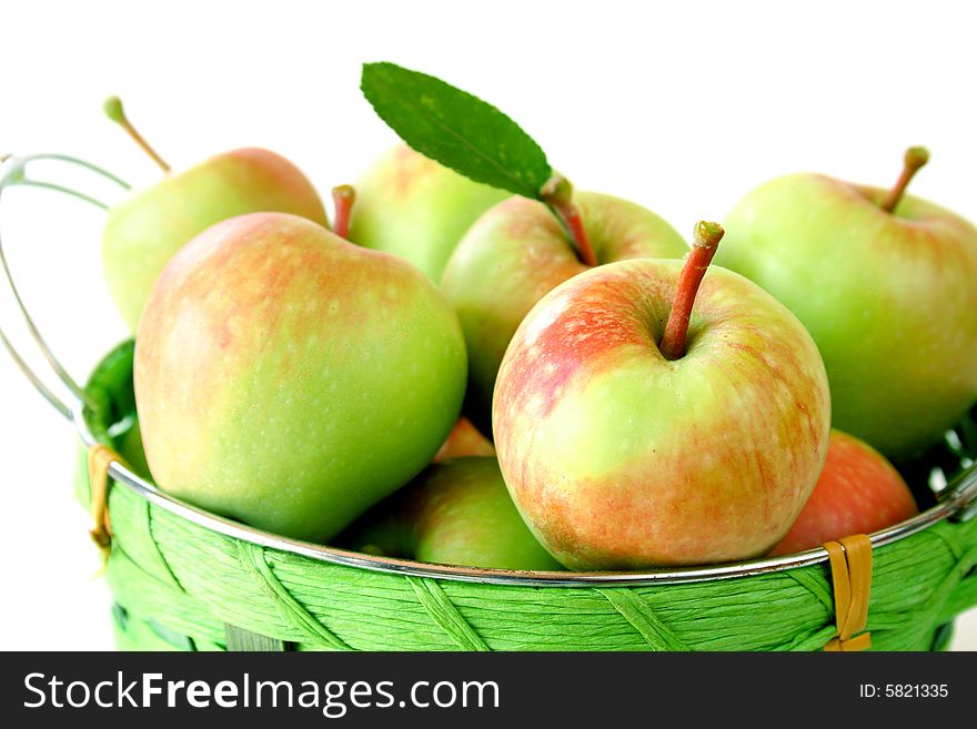 Close up of a basket of apples isolated on a white background. Close up of a basket of apples isolated on a white background.