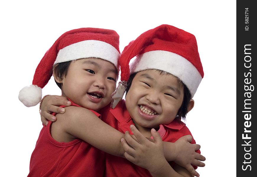 Two little girls who celebrate christmas day with white background. Two little girls who celebrate christmas day with white background
