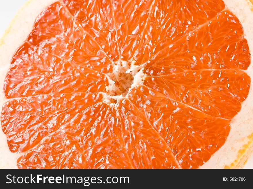 Fresh juicy grapefruit. Close up on a white background. Fresh juicy grapefruit. Close up on a white background.