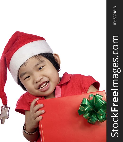 Portrait of a little girl with santa hat and gift. Portrait of a little girl with santa hat and gift