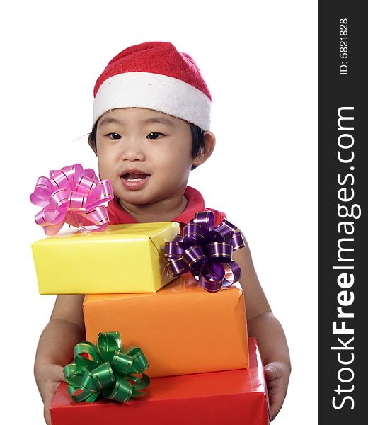 Portrait of a little girl with santa hat and gift. Portrait of a little girl with santa hat and gift