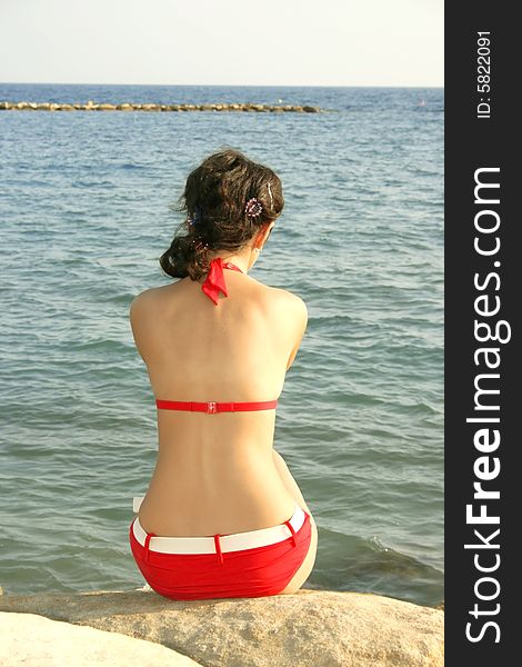 Prety girl in red bikini on the beach. Prety girl in red bikini on the beach.