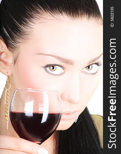 Portrait of a cute brunette holding a glass of red wine on white background. Portrait of a cute brunette holding a glass of red wine on white background