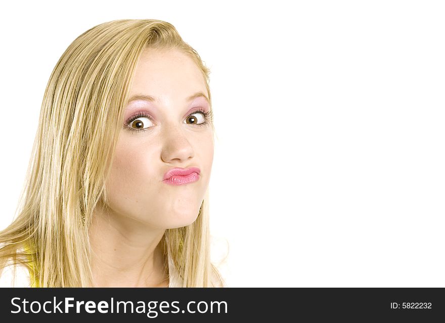 A portrait of a beautiful blond bratty Caucasian young girl (15-24) on white background, model release. A portrait of a beautiful blond bratty Caucasian young girl (15-24) on white background, model release.