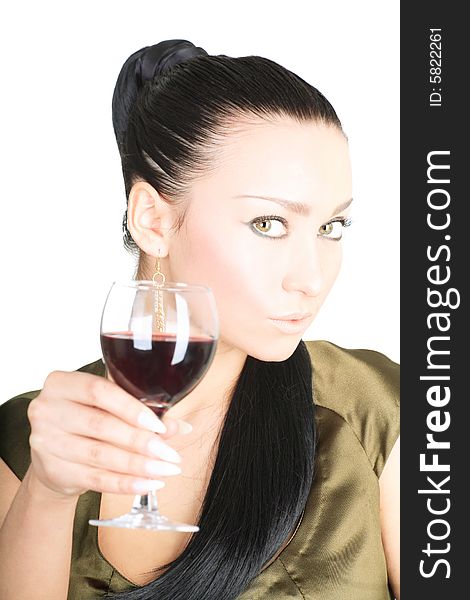 Portrait of a cute brunette holding a glass of red wine on white background. Portrait of a cute brunette holding a glass of red wine on white background