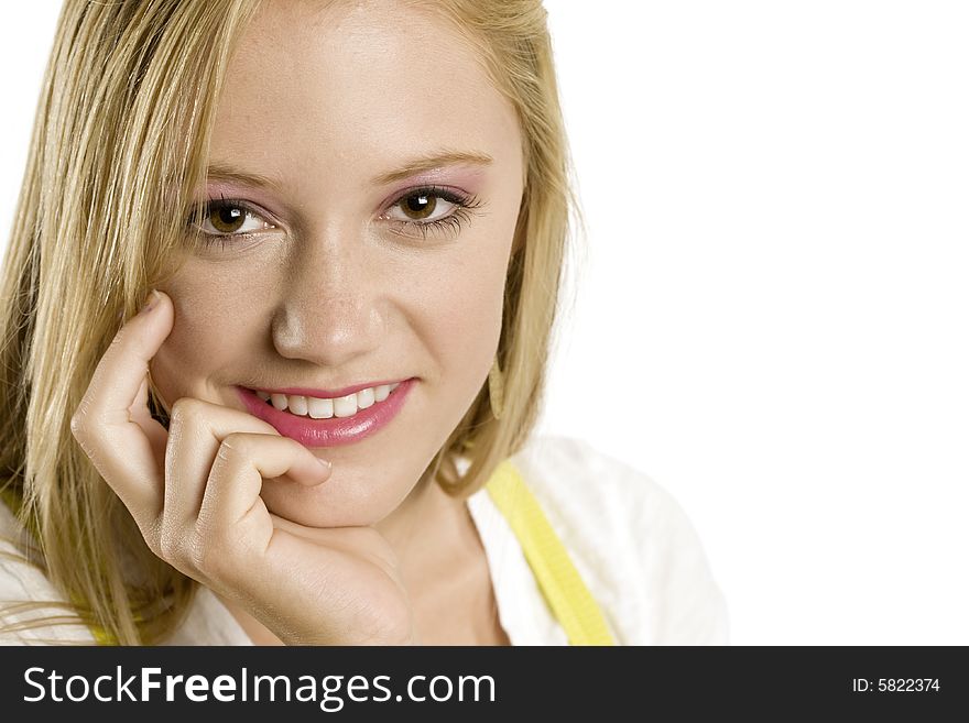 A portrait of a beautiful blond smiling Caucasian young girl (15-24) on white background, model release. A portrait of a beautiful blond smiling Caucasian young girl (15-24) on white background, model release.