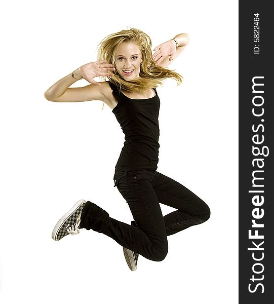 A beautiful blond Caucasian young girl (15-24) jumping with joy on white background, model release. A beautiful blond Caucasian young girl (15-24) jumping with joy on white background, model release