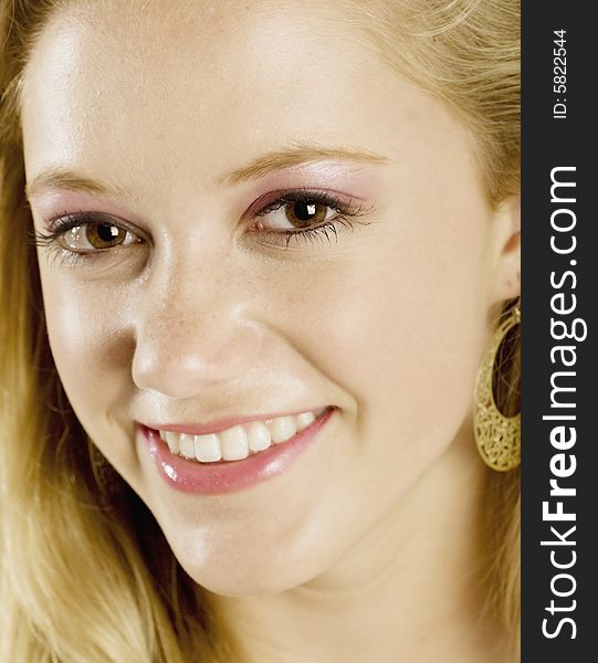 A portrait of a beautiful blond smiling Caucasian young girl (15-24), model release. A portrait of a beautiful blond smiling Caucasian young girl (15-24), model release.