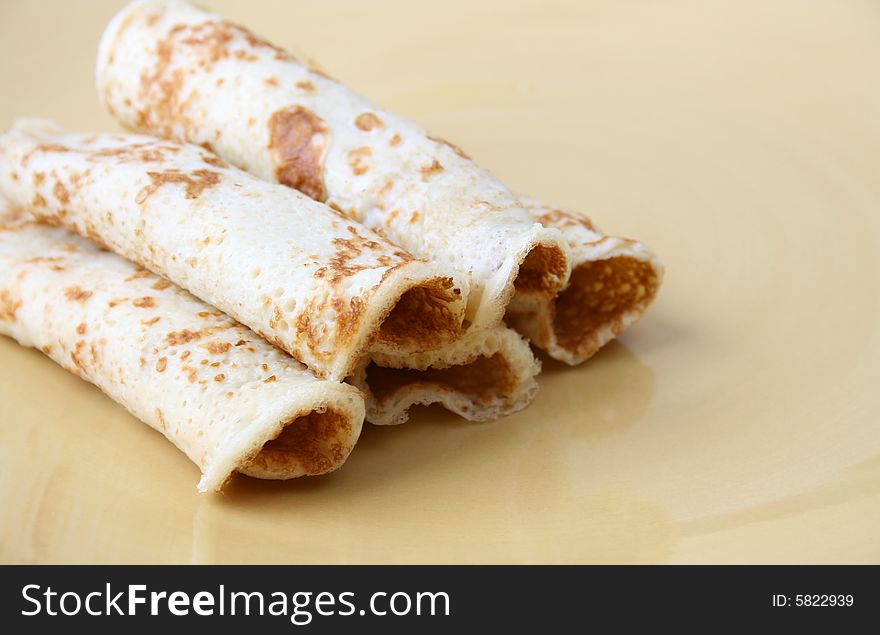 Close up of pancakes on a yellow plate. Close up of pancakes on a yellow plate