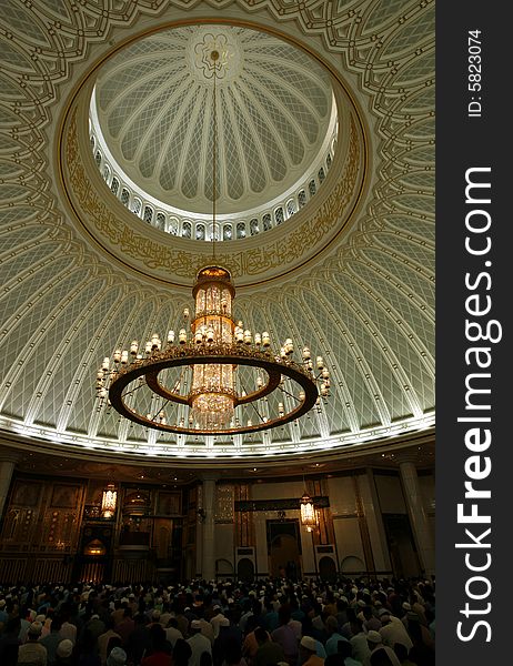 Chandelier and decorated ceiling in a mosque