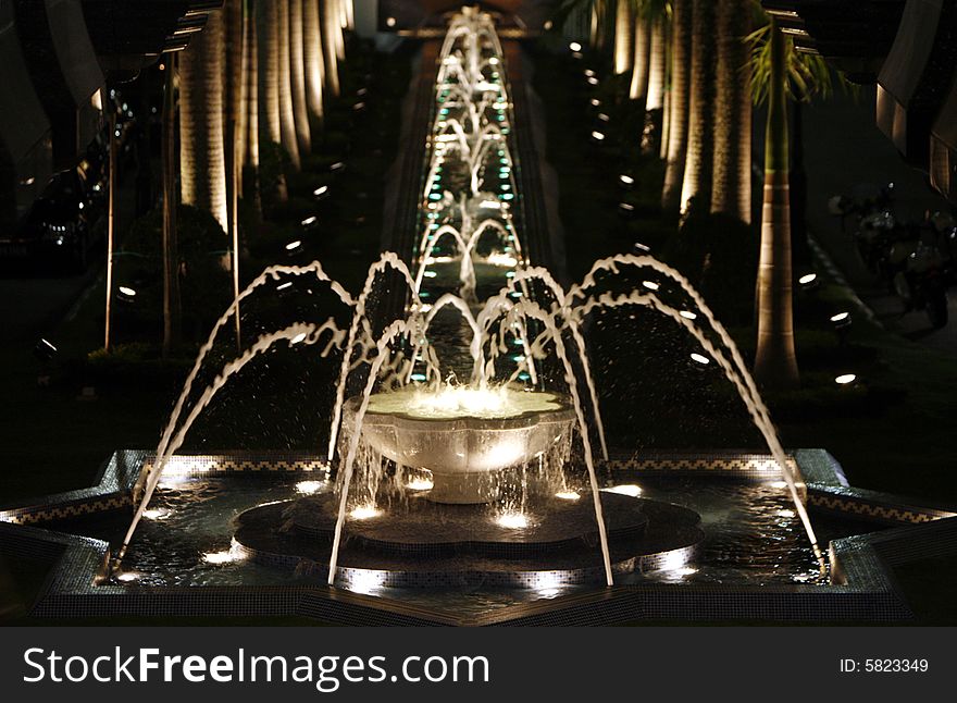 A water fountain at night.
