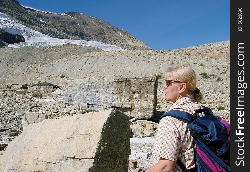 Woman Walking In The Rocky Mountains