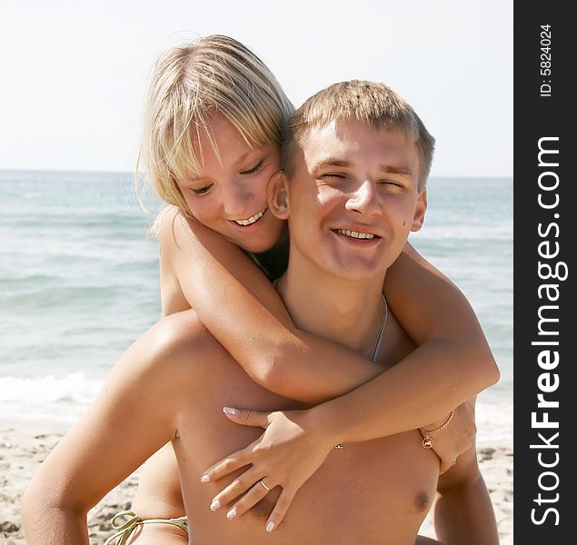 Portrait of young couple on beach