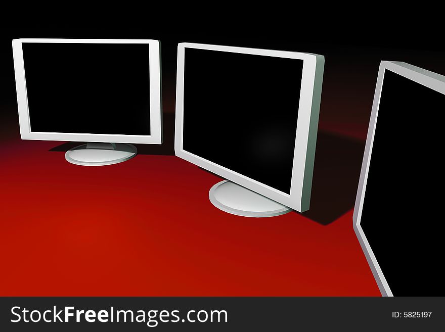 3 LCD Monitors On A Table