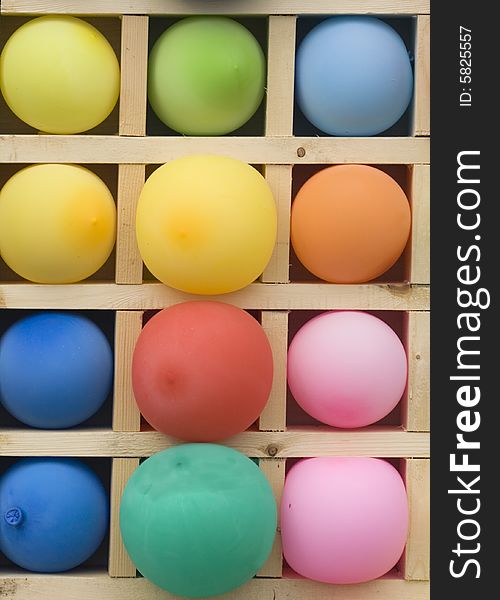 Bright inflatable spheres in wooden boxes