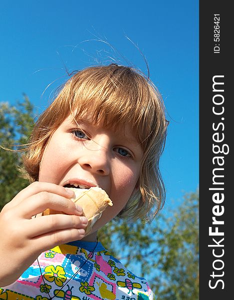 Pretty little girl eating ice-cream. Pretty little girl eating ice-cream