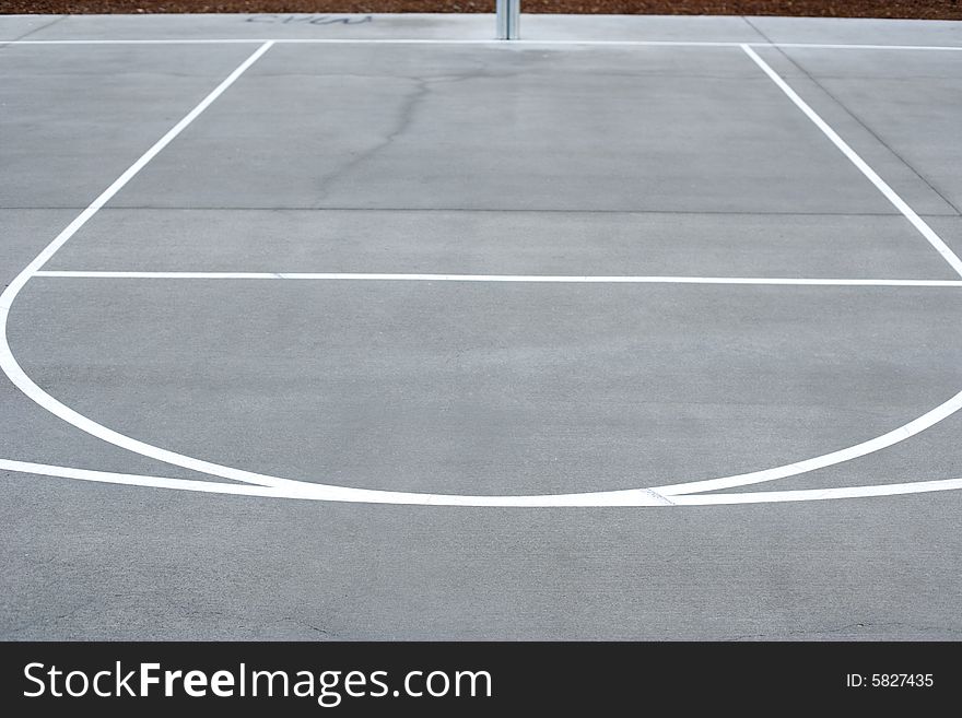 A basket ball hoop on an out door court