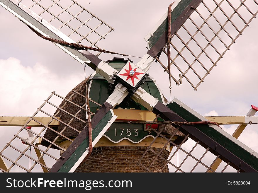 A detail of a water wind mill in the county