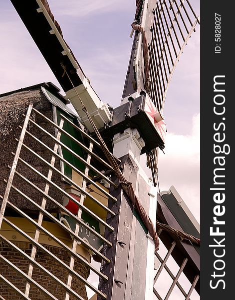 A detail of a water wind mill in the county