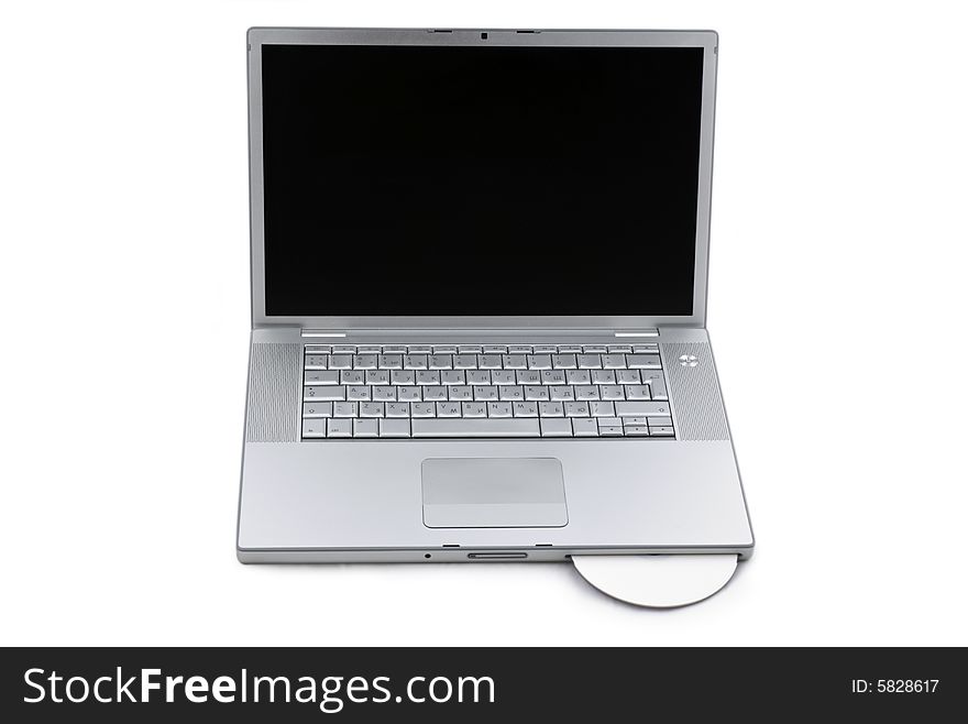Silver portable computer with CD inserted. Front view. Silver portable computer with CD inserted. Front view.