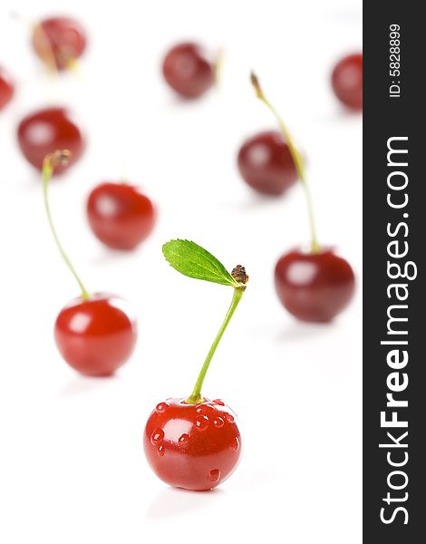 Cherry with green leaf and drops. Cherry with green leaf and drops