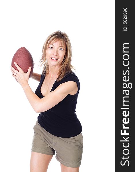 Woman throwing football, isolated on white