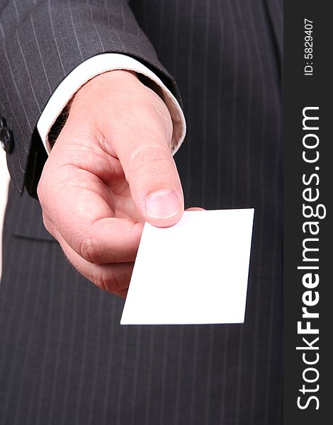 Hand of businessman offering business card. Hand of businessman offering business card