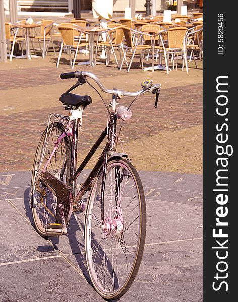 A bicycle parked at a compass rose