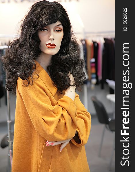 The woman mannequin in yellow dress