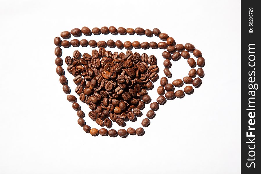 Cup of coffee from coffee beans on lightt background