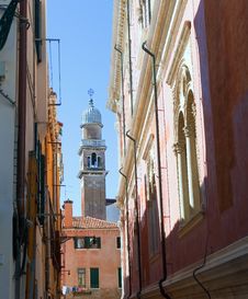 Dome Of Bell Tower Behind An Old Roofs. Royalty Free Stock Photo Dome Of Bell Tower Behind An Old Roofs. Royalty Free Stock Photo